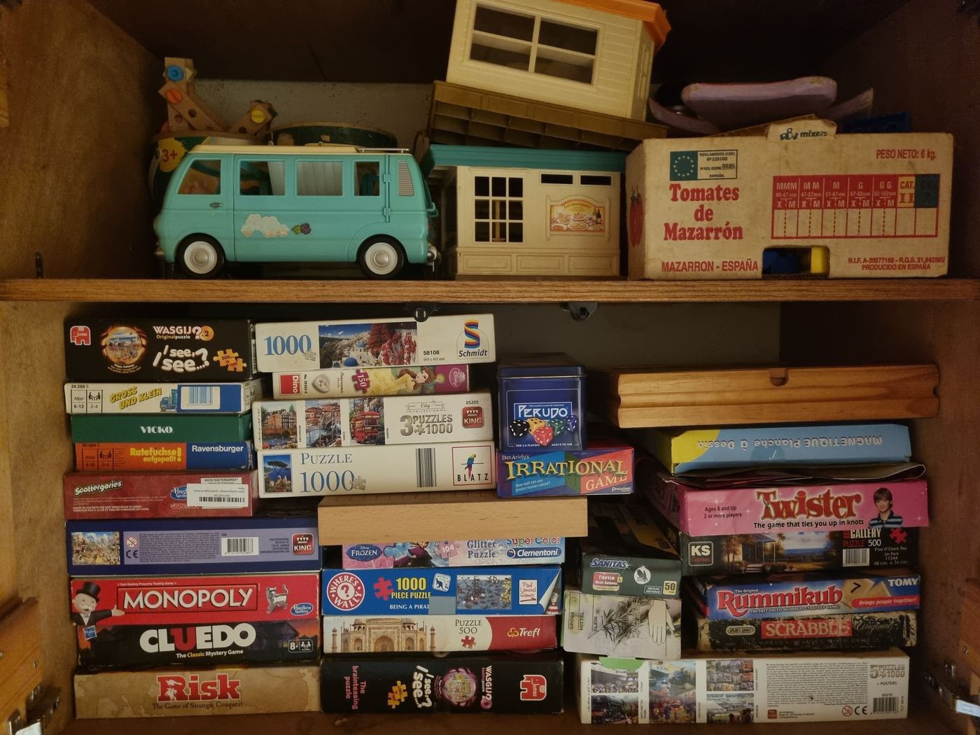 The games cupboard: Monopoly, Cluedo, Scrabble, Twister, jigsaws, and toys for smaller guests.