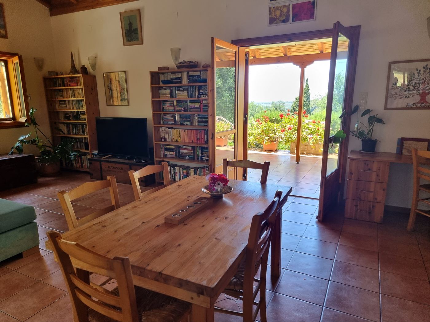 The living and dining room, with the doors open to the veranda.