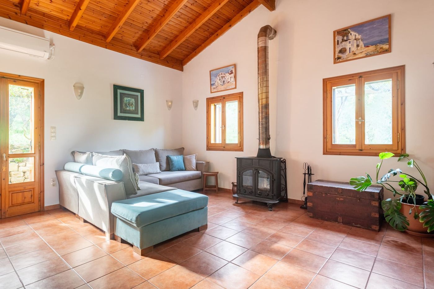 The sofa and the wood-burning stove, in the sitting room.