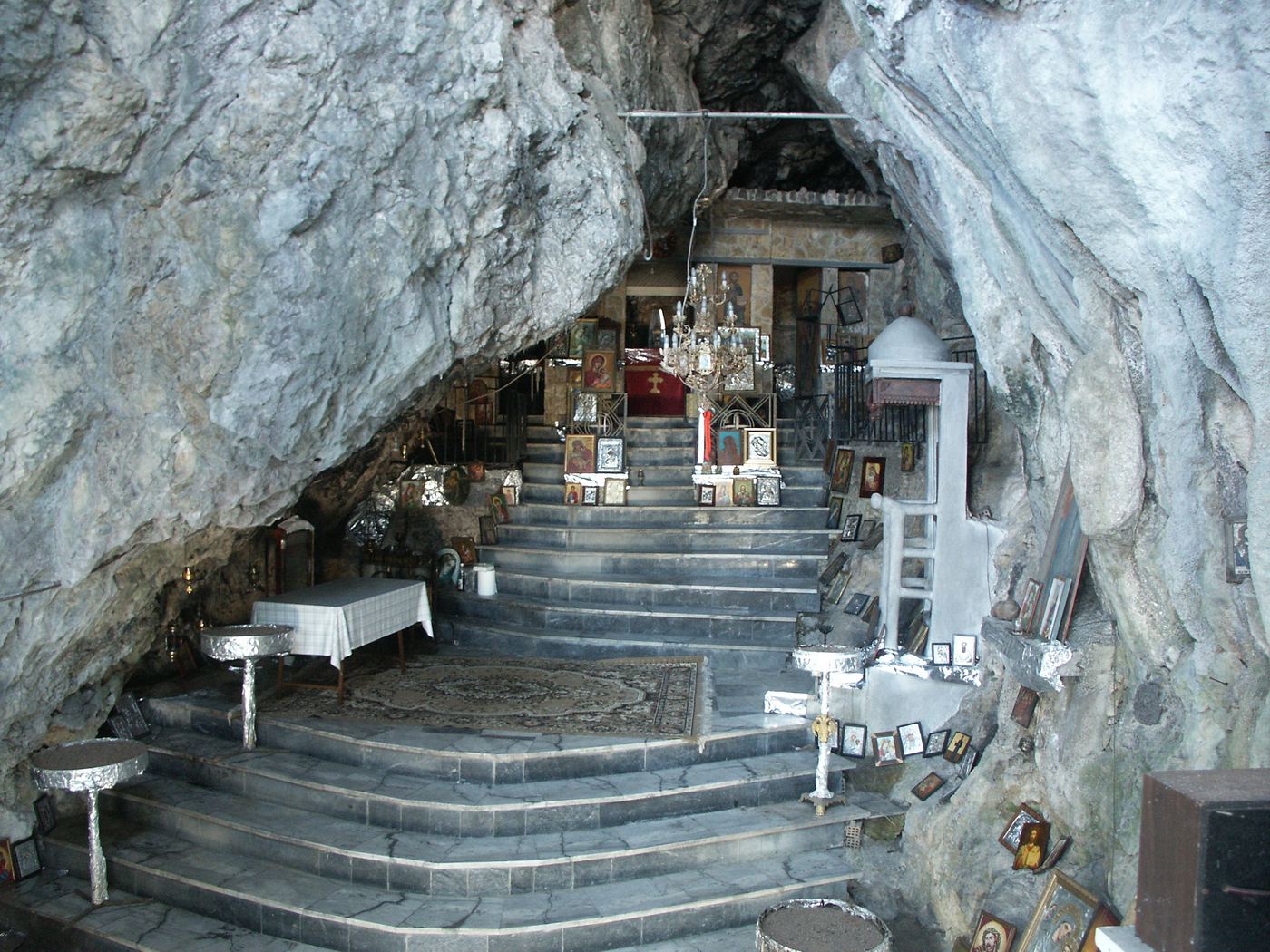 Inside the chapel, in the cave.