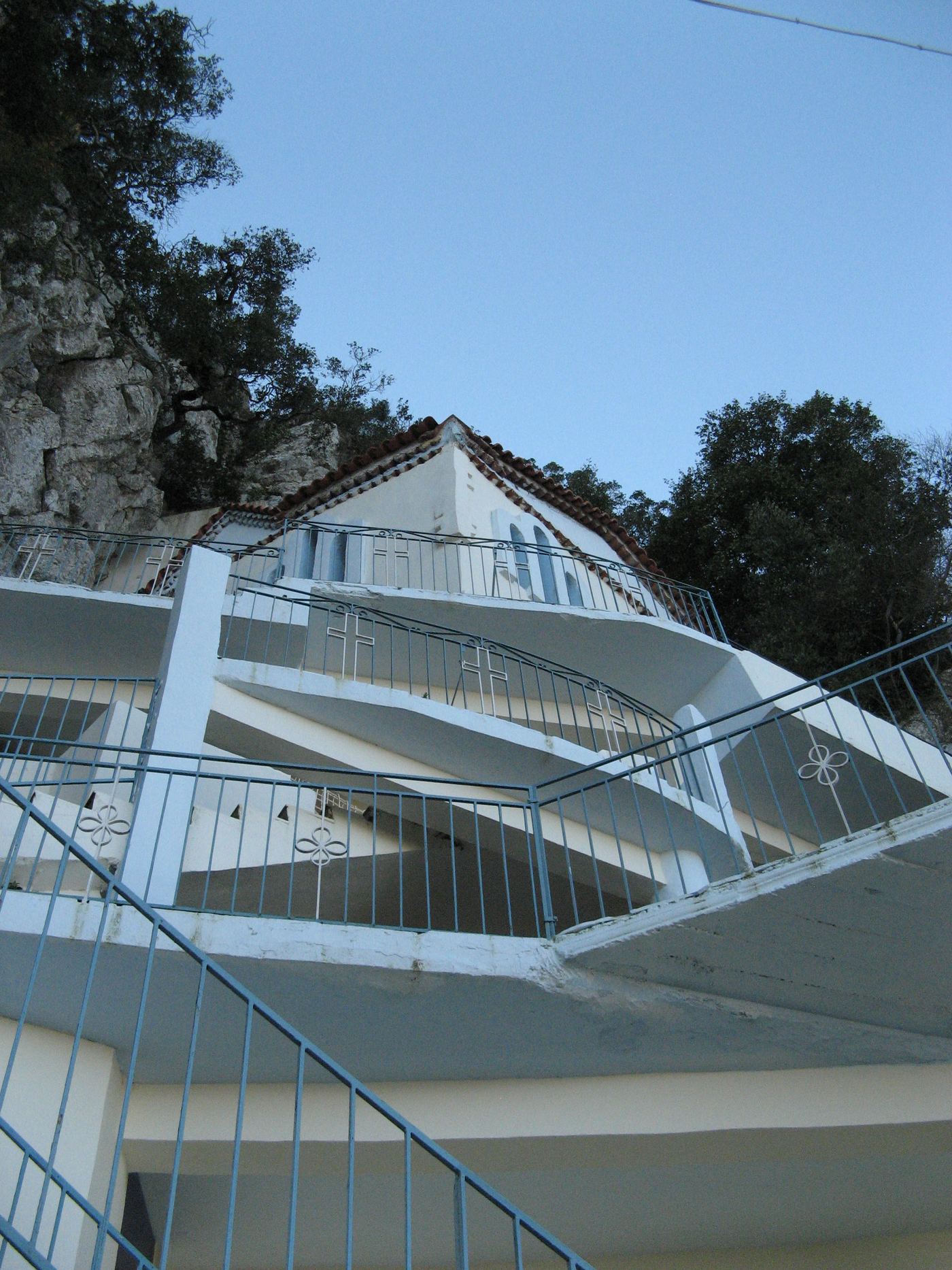 The church facade, built directly onto the cliff face.