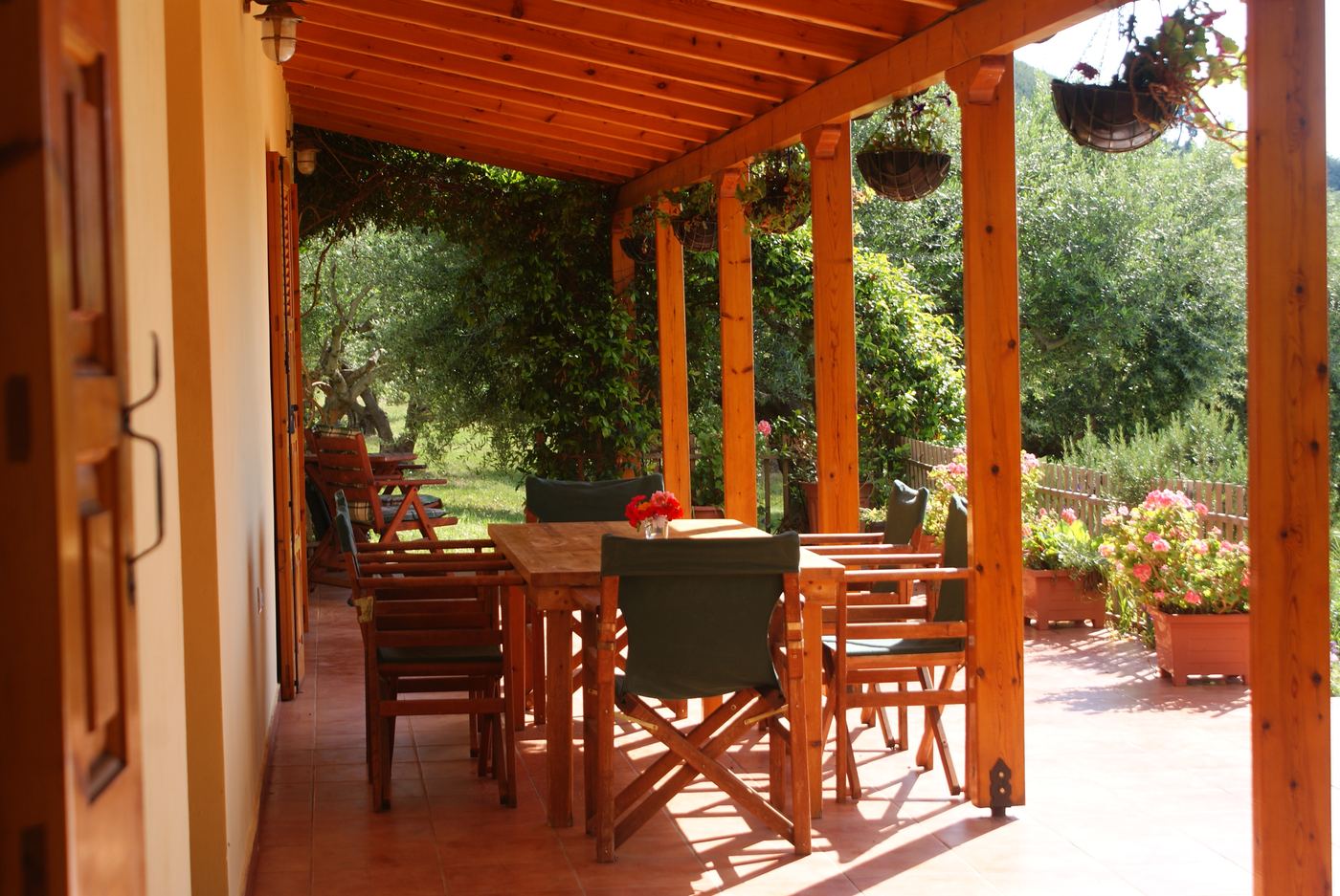 Eating outside on the veranda, under the wooden roof.