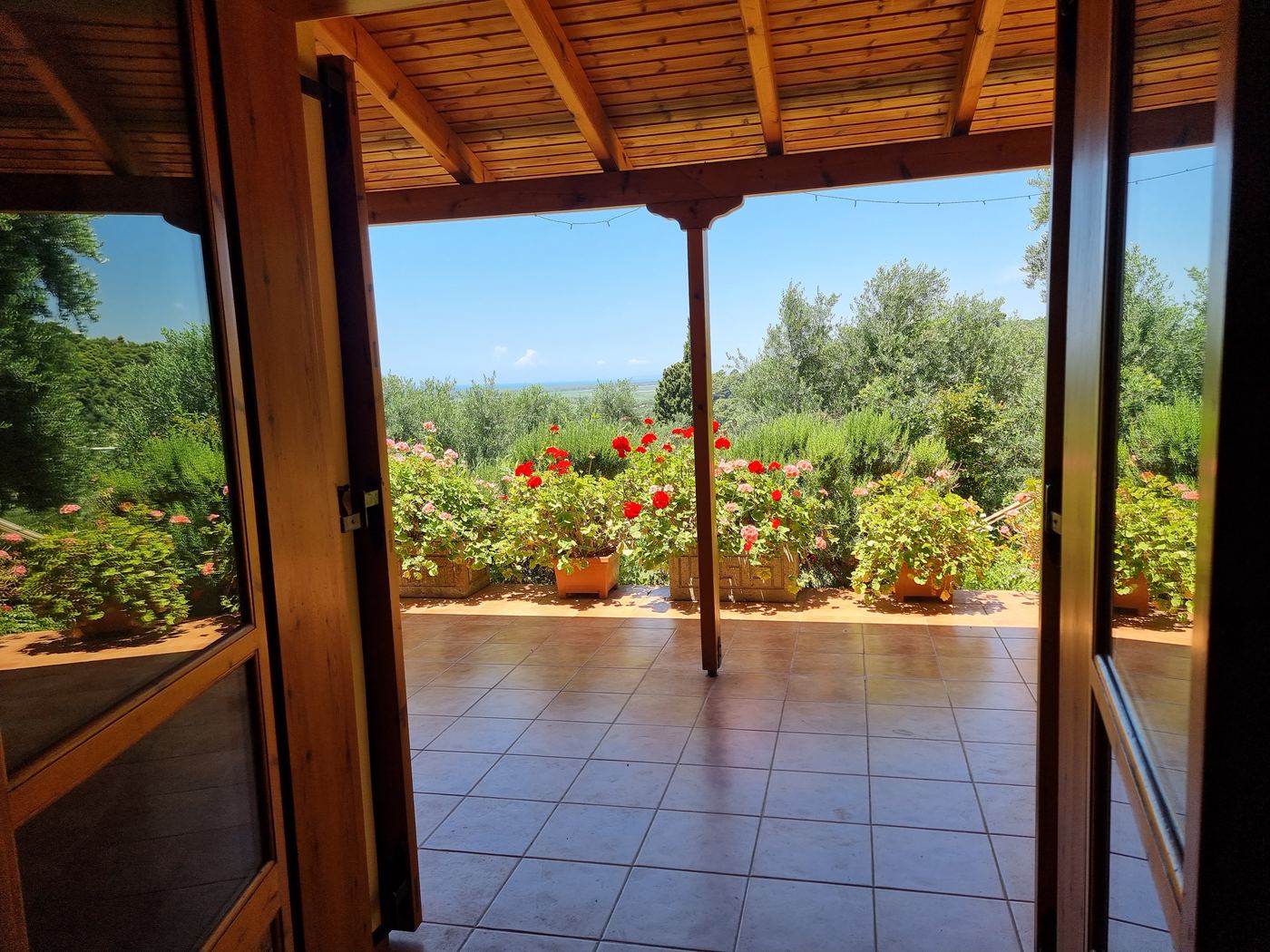 The covered veranda, with the sea on the horizon.